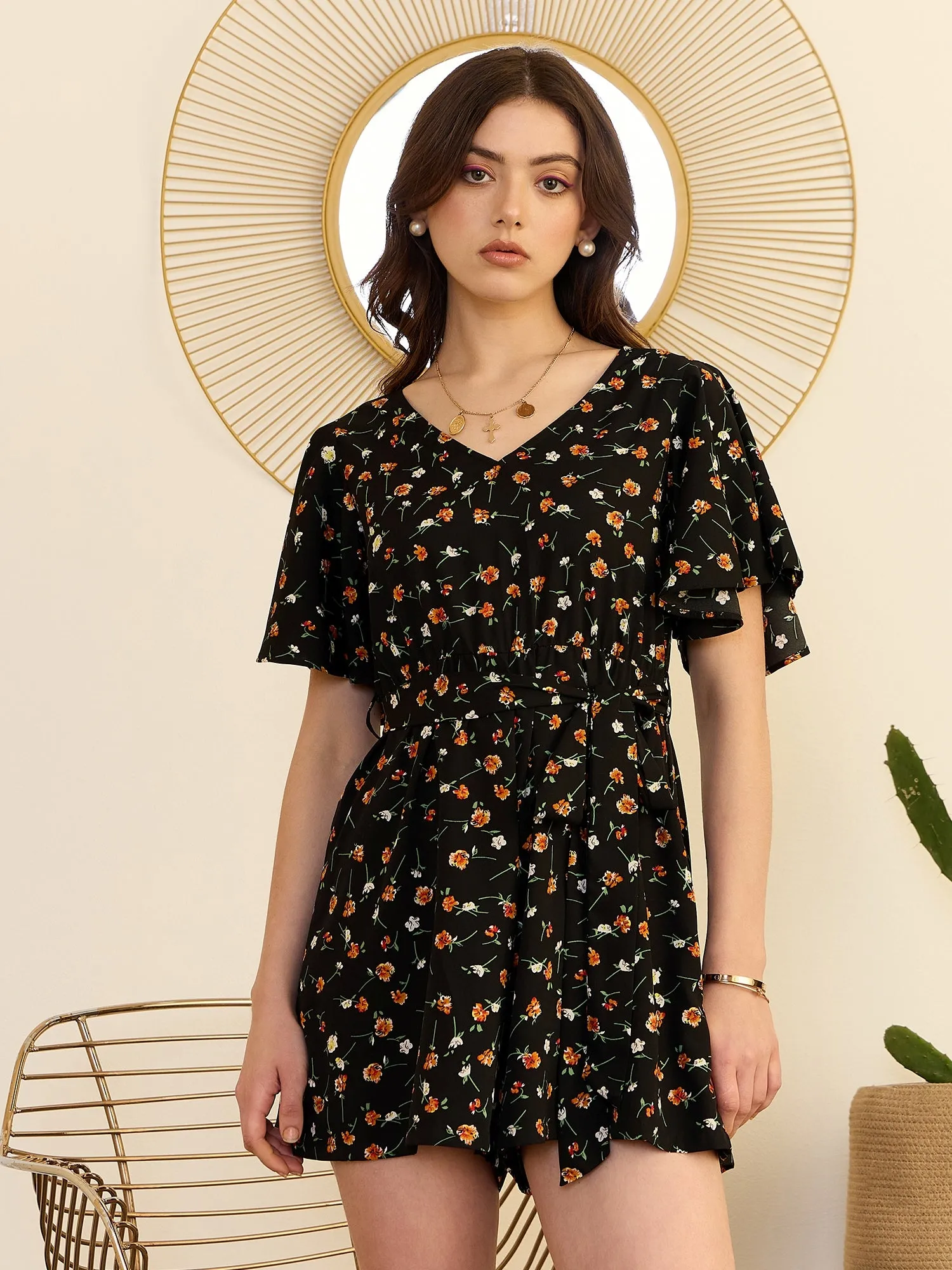 Berrylush Women Black & Orange Floral Printed V-Neck Back Keyhole Waist Tie-Up Mini Romper Jumpsuit